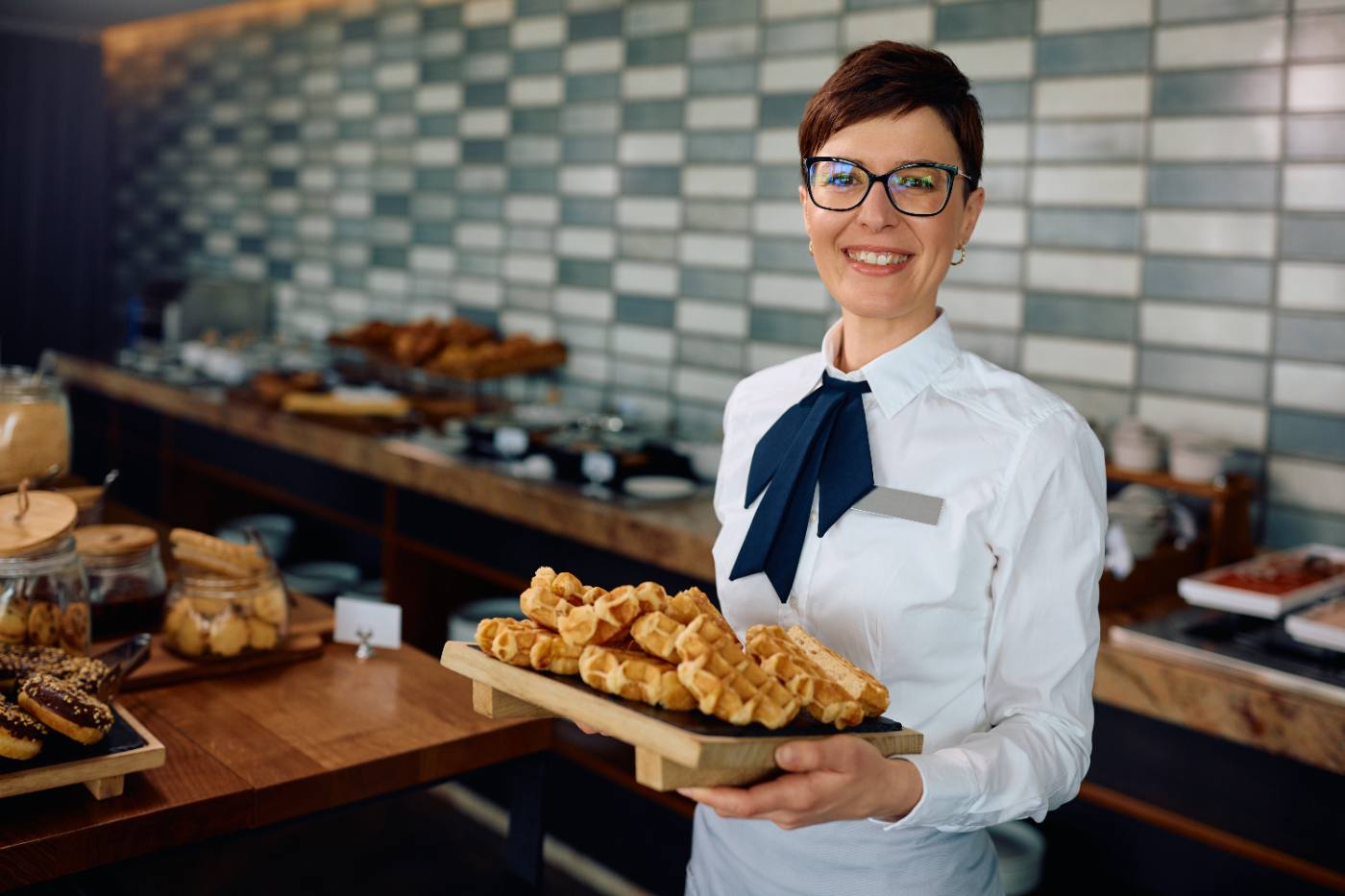 A partner kitchen plating a buffet